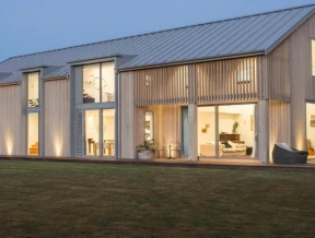 This Contemporary Interpretation Of A Barn Is Clad In Pale Timber Tones